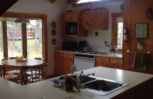 Weld House | Inviting Cottage with Deck and Scenic Lakefront Views