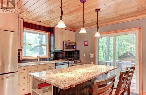 Grand Bend Cottage | Family Cottage Steps from Beach with Pool & Ocean Views