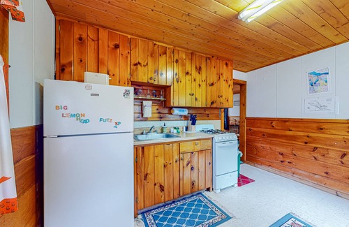 Indian River Cottage | Inviting Lakefront Cottage with Dock and Fire Pit