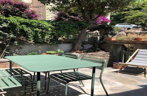 Nonza Apartment | Serene Garden Apartment with Ocean View in Village Center