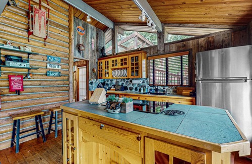 Gold Bar House | Charming riverfront cabin with hot tub, deck, mountain views and W/D