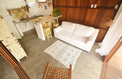 Barra Grande House | Escape to the Yellow Bungalow on Algodões Beach Today