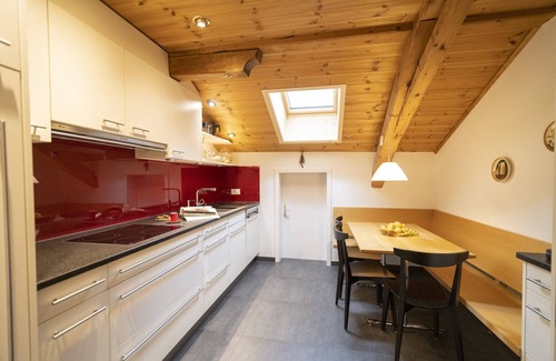 Engadin Scoul Apartment | Stunning Rooftop Flat with Panoramic Views in Ftan