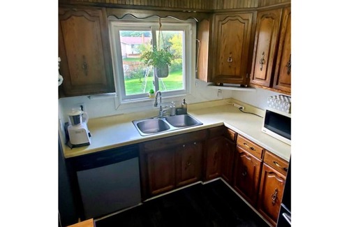 Algoma District House | Inviting 4-Bedroom Retreat with Pool and Spa Amenities