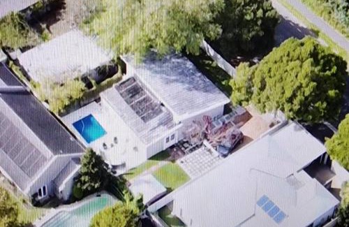 Tokai House | Charming Cherry Cottage: Oceanfront Poolside Retreat