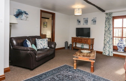 Penny Bridge Cottage | Pet-Friendly Cherry Tree Barn with Cozy Open Fire