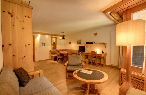 Silvaplana Apartment | Chesa Munteratsch: 4-Star Retreat with Child-Friendly Comfort