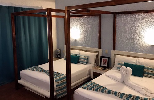 Puerto Aventuras Hotel | Relax at Chez Waffle Hotel with Pool and Ocean Views