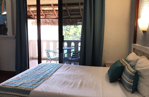 Puerto Aventuras Hotel | Relax at Chez Waffle Hotel with Pool and Ocean Views