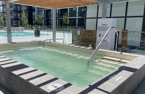 Innisfil Apartment | Stylish 2BR Retreat with Pool, Hot Tub & Patio at Friday Harbour