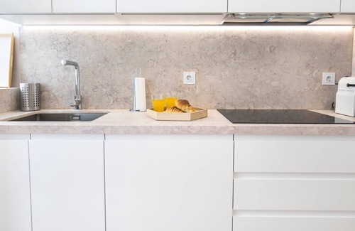 Bairro Alto Apartment | Stylish Citrus Retreat with Private Garden for Families