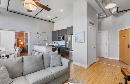 South Haven Condo | Discover Chic Downtown Loft with Pool & Hot Tub in South Haven