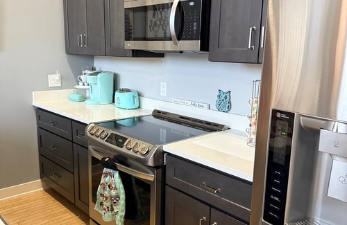 South Haven Condo | Discover Chic Downtown Loft with Pool & Hot Tub in South Haven