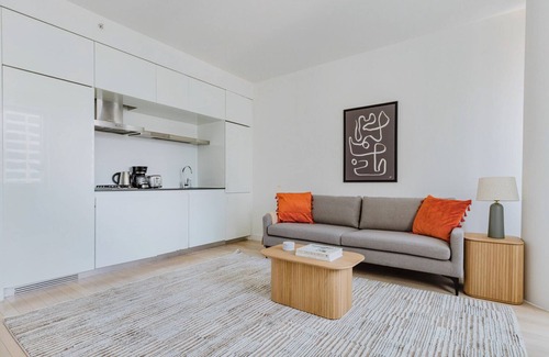 Central New York City Apartment | Chic Midtown 2BR w/Gym, W/D & A/C, near Rock Ctr, by Blueground