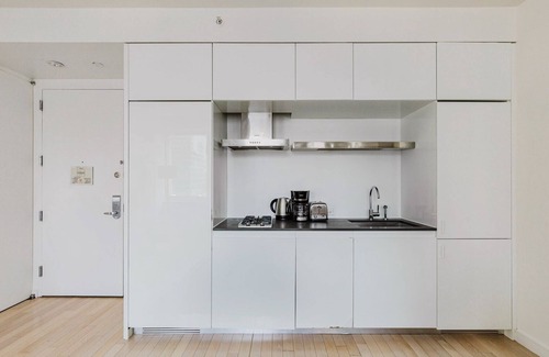 Central New York City Apartment | Chic Midtown 2BR w/Gym, W/D & A/C, near Rock Ctr, by Blueground