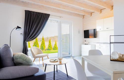 Karwienskie Bloto Drugie Apartment | Peaceful Cichy Domek: Pool, Playground & Pet-Friendly Stay