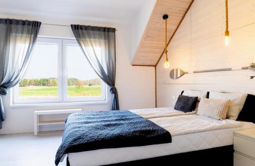 Karwienskie Bloto Drugie Apartment | Peaceful Cichy Domek: Pool, Playground & Pet-Friendly Stay