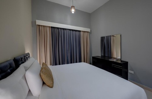 Dubai Investment Park Apartment | Comfortable City Stay Residences with Pool & Family Amenities