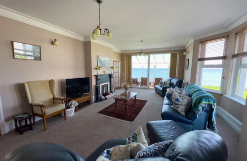 Borth House | Cliff Haven: Oceanfront Retreat with Pet-Friendly Amenities