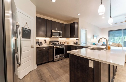 Lakeside Village Condo | Modern 2-Bed Condo with Balcony, Hot Tub & Fireplace