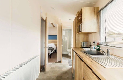 Hamworthy Apartment | Cozy Club Tropicana Caravan for 4 with Breakfast Included