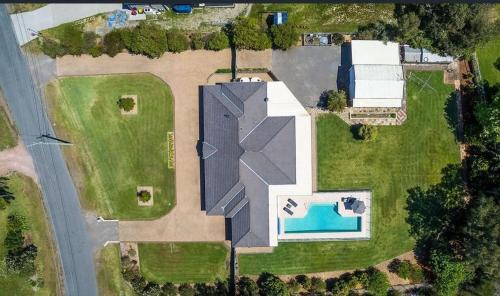 One Mile House | Coast and Country Estate: Poolside Paradise Near the Beach