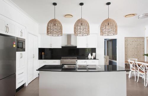 One Mile House | Coast and Country Estate: Poolside Paradise Near the Beach