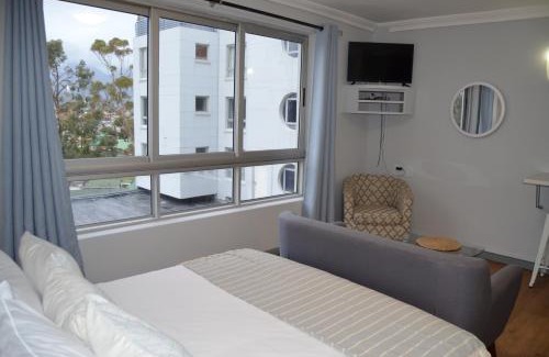 Strand Hotel | Relaxing Coastal Comfort with Oceanfront Views and Pool