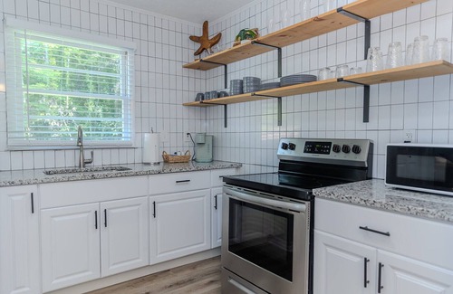 Covington House | Coastal Cottage: Family-Friendly Retreat Near Covington Square
