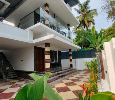 Kuzhuppilly House | Beachfront Coastal Den Homestay with Private Ocean Access