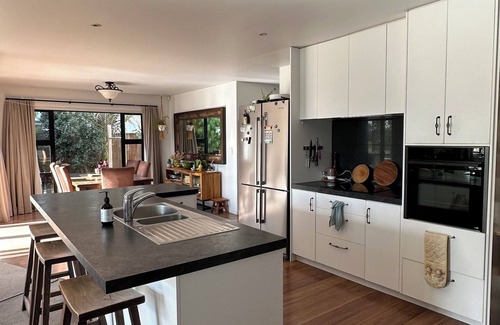 Papamoa Beach House | Coastal family home, 5 minutes walk to beach, hot tub, fully accessible