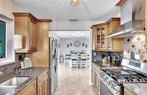 Garden Isles House | Coastal Gem: Relax by the Pool and Indulge in Luxury