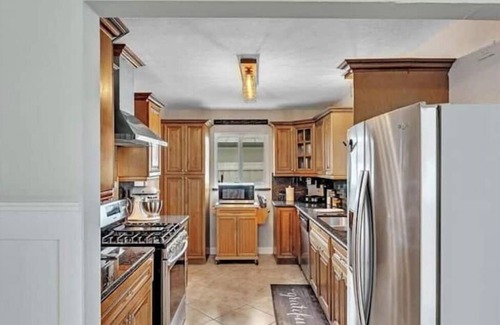 Garden Isles House | Coastal Gem: Relax by the Pool and Indulge in Luxury