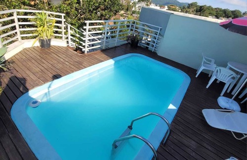 Canasvieiras Apartment | Inviting Poolside Retreat in Canavieiras, Florianópolis