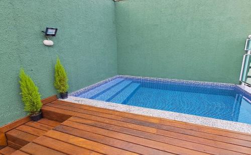 Jardim Sao Miguel Apartment | Relaxing Retreat with Pool at Praia da Enseada