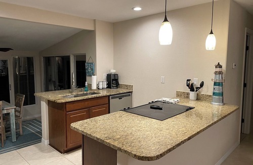 Laurel House | Inviting Beach Cottage with Pool and Golf Cart Access