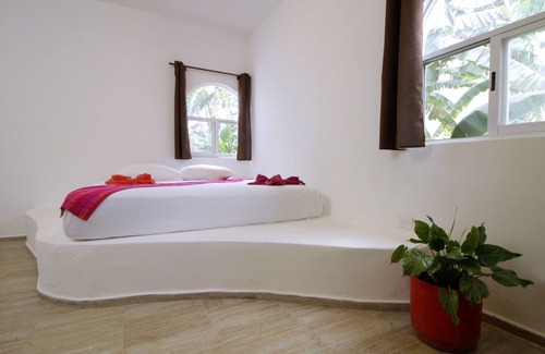 Motul Hotel | Discover Coco Resort: Family-Friendly with Pool & Dining