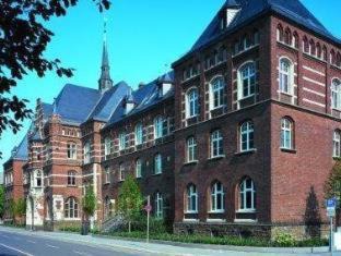 Old Town Hotel | Discover Collegium Leoninum: Oceanfront Comfort & Poolside Fun