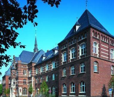 Old Town Hotel | Discover Collegium Leoninum: Oceanfront Comfort & Poolside Fun