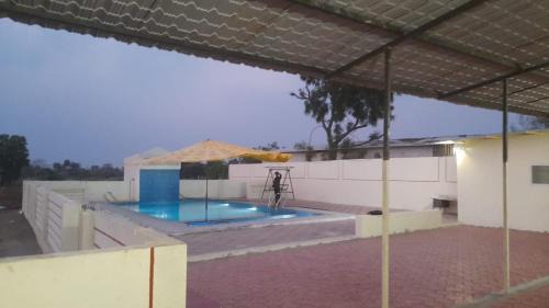 Mhow Apartment | Discover Comfort at Colonels Oasis Resort with Great Amenities