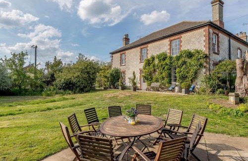 Thetford House | Experience Colveston Manor: 5-Star Stay with Family-Friendly Amenities