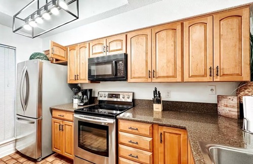 New Braunfels Condo | Comal River View 2BR Condo Steps to Schlitterbahn with Pool Sleeps8
