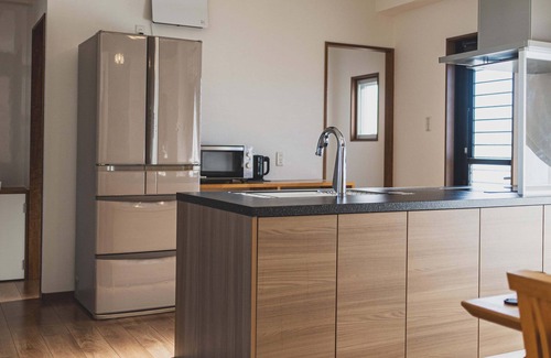 Kuwae Apartment | Experience Comfort Plus: Guest Rated 9.8 with Ocean Views