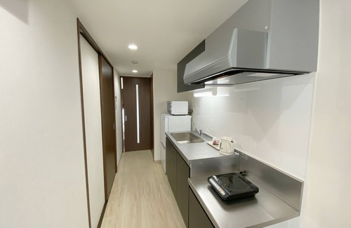 Kuwae Apartment | Experience Comfort Plus: Guest Rated 9.8 with Ocean Views