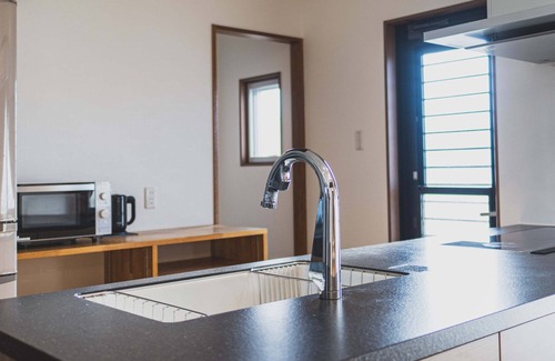Kuwae Apartment | Experience Comfort Plus: Guest Rated 9.8 with Ocean Views