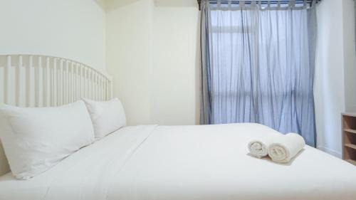 Makassar Apartment | Cozy 2BR Retreat at Vida View Apartment by Travelio