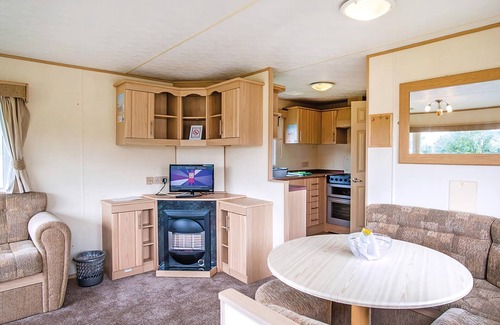 Llanllwchaiarn House | Inviting Caravan with Pool and Oceanfront Views