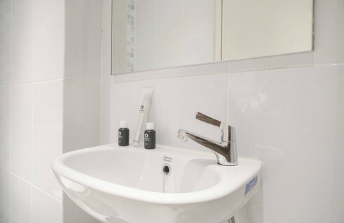 Grogol Utara Apartment | Cozy Riverside Studio with Kitchen & Breakfast in Tokyo