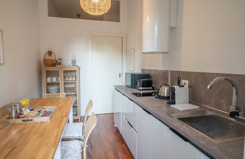 Citta Bassa Apartment | Inviting Furnished Apartment with Spa and Kitchen Amenities