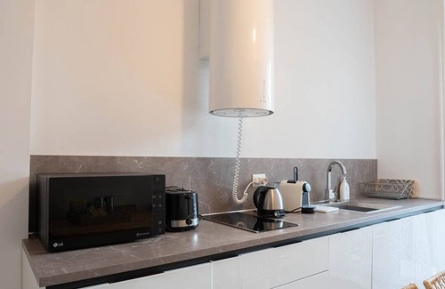 Citta Bassa Apartment | Inviting Furnished Apartment with Spa and Kitchen Amenities